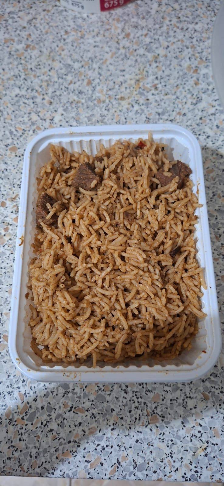 A single portion of Kenyan pilau packed for collection in District VII, Budapest